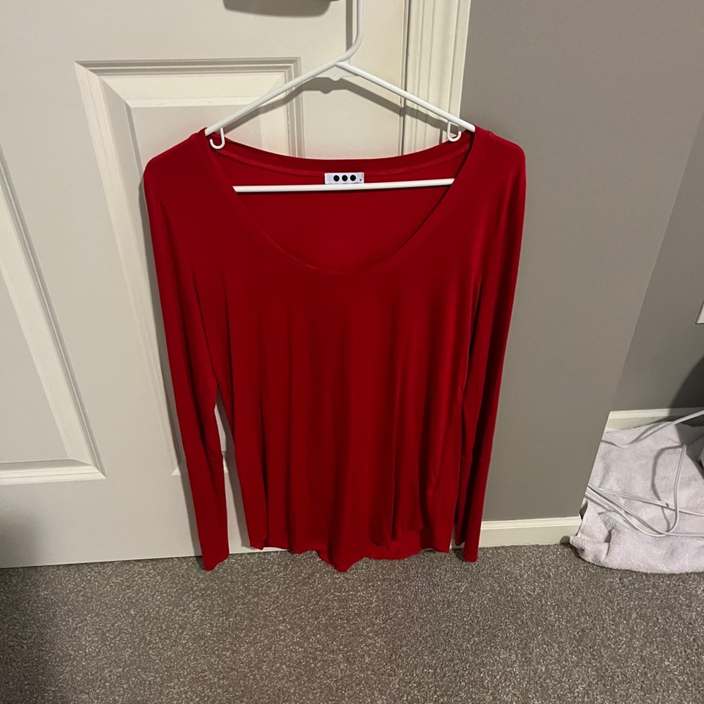 Three dots long sleeve size medium color is red. Like new condition